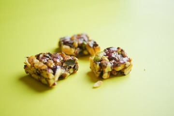 Almond , Raisin and oat protein bars on table 