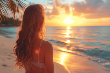 Fototapeta na wymiar Woman at sunset beach.