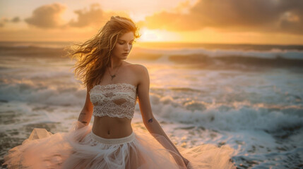 This romantic ensemble features a lace crop top paired with a highwaisted tulle skirt finished off with spy sandals and a dainty necklace. The background is a sunkissed beach - obrazy, fototapety, plakaty