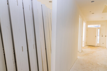 New home is being constructed with interior wooden doors that are being prepared for installation