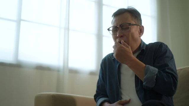 
Mature old man gray-haired have throat irritation mucus and coughing. Fever headache respiratory tract infection. Senior mane unhealthy Sickness need to consult a doctor and get treatment.