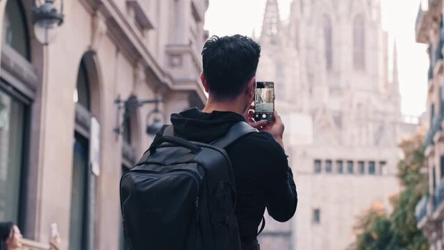 The Traveler's Lens: A Man Capturing Barcelona's Gothic Quarter