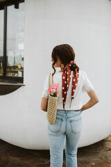 A woman with a hair scarf
