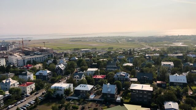 Aerial panoramic view of Reykjavik suburbs on sunny evening or morning