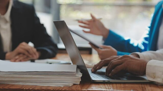 Team of business people are meeting to analyze data for marketing plan,Market research reports and income statistics, Financial and Accounting concept.