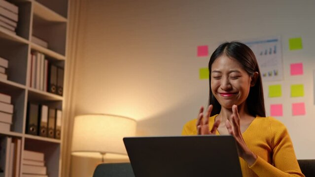 Asian businesswoman, self-employed working on a laptop computer typing e-commerce marketing financial report on real estate project in office management concept.