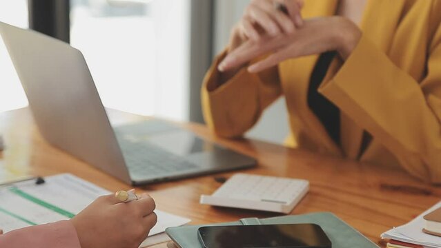 Team of business people are meeting to analyze data for marketing plan,Market research reports and income statistics, Financial and Accounting concept.