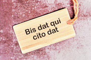 Bis dat qui cito dat It is translated from Latin as The one who gives twice is the one who gives quickly on the card with the rope