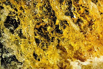 Golden tannins in a closeup of a waterfall in Connecticut.