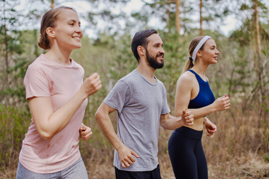 Active people jogging outdoors fresh air