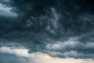 Naklejka na ściany i meble Dark sky with stormy clouds. Dramatic sky rain,Dark clouds before a thunder-storm.