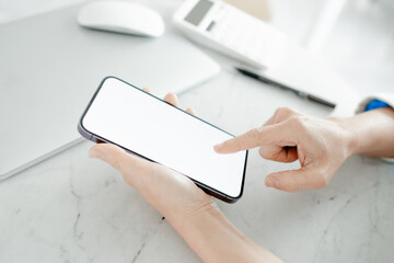 Woman holding smart phone with blank copy space screen for your text message or your content