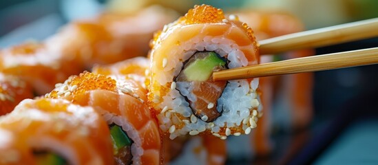 Macro photography capturing the art of Japanese cuisine with a close up of a person delicately eating sushi with chopsticks