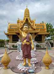 Golden designed buddhist temple architecture pagoda and standing buddha statue at the Ancient City...
