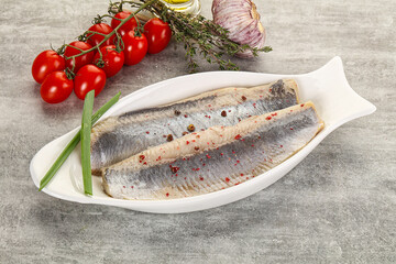 Marinated herring fillet with green onion