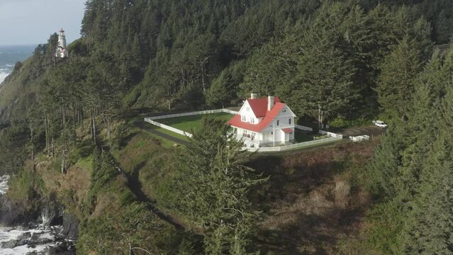 Drone rises over the Haceta Head assistant lightkeeper's house in Oregon.