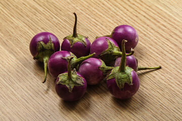 Raw small purple asian baby eggplant