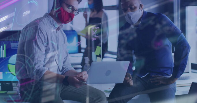 Image of financial data processing over diverse businessmen with face masks talking in office