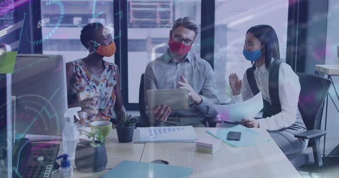 Image of financial data processing over diverse business people with face masks at meeting - Powered by Adobe