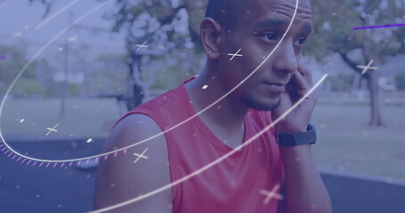 Image of circular scope processing data over male athlete wearing wireless earphones outdoors