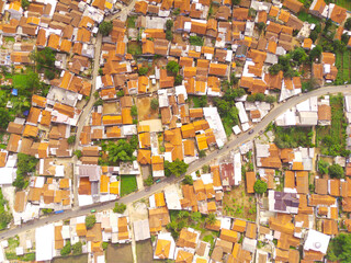 Aerial view of Highly Populated Area in Bandung City, capital of West Java Province, Indonesia. One of the most densely populated residential districts in Asia.Shot from a drone flying 200 meters high