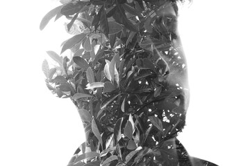 Double exposure male portrait with leafy facial features - 740498575