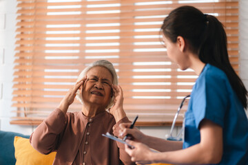 Young asian woman or nurse care hand on senior grandmother shoulder give support empathy to elderly...