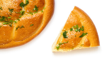 Salty homemade pie and piece of pie on white background. Homemade cakes top view.