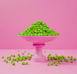 The cake stand and peas, bright pink background. Pink and green, table food photography. Simple...