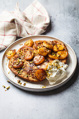 French toast with caramelized banana and pistachios.