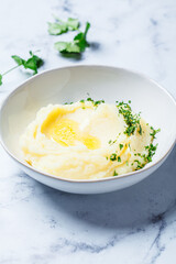 Classic mashed potatoes with butter and herbs.