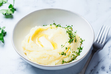 Classic mashed potatoes with butter and herbs.