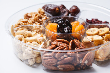Dried fruits and nuts on a plate to celebrate the Jewish holiday Tu Bi Shvat.