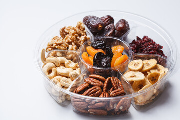 Dried fruits and nuts on a plate to celebrate the Jewish holiday Tu Bi Shvat.
