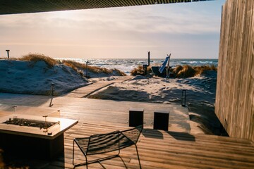 House on the shore of the Baltic Sea. Terrace at sunset © Cavan