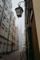 Fototapeta na wymiar Foggy European old town of Gdansk in Poland