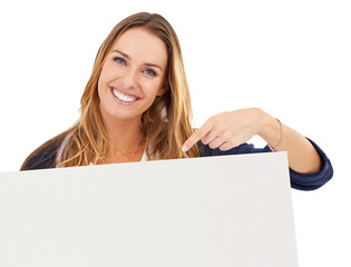 Naklejka premium Pointing, blank sign and portrait of woman with deal, promo or happy news in studio. Smile, offer and girl with poster announcement, information or presentation space on cardboard on white background