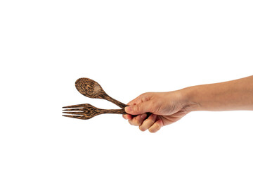 Wooden spoon and wooden fork in hand isolated on transparent background.