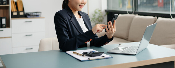 businesswoman hand working with new modern computer using on smartphone and tablet as concept