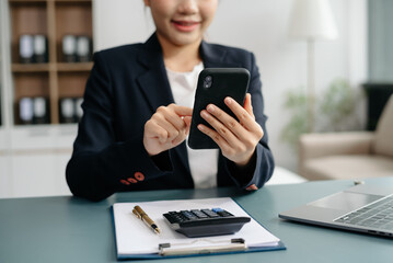businesswoman hand working with new modern computer using on smartphone and tablet as concept