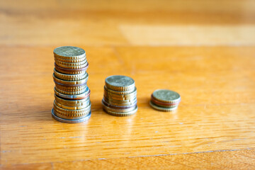coins stacked to three small towers