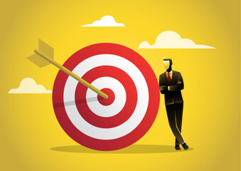 Confidence businessman leaning on a giant target achievement