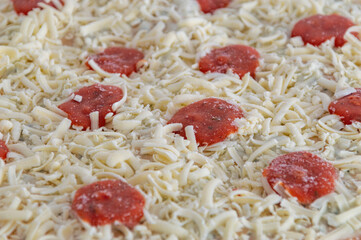 Detail of frozen pizza. Macro view on frozen pizza.
