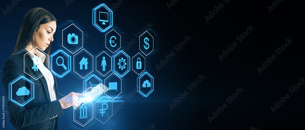 Aufkleber Attractive young european woman using tablet with abstract hexagonal pattern hologram with various business icons on wide dark background with mock up place. Digital dashboard and data concept.