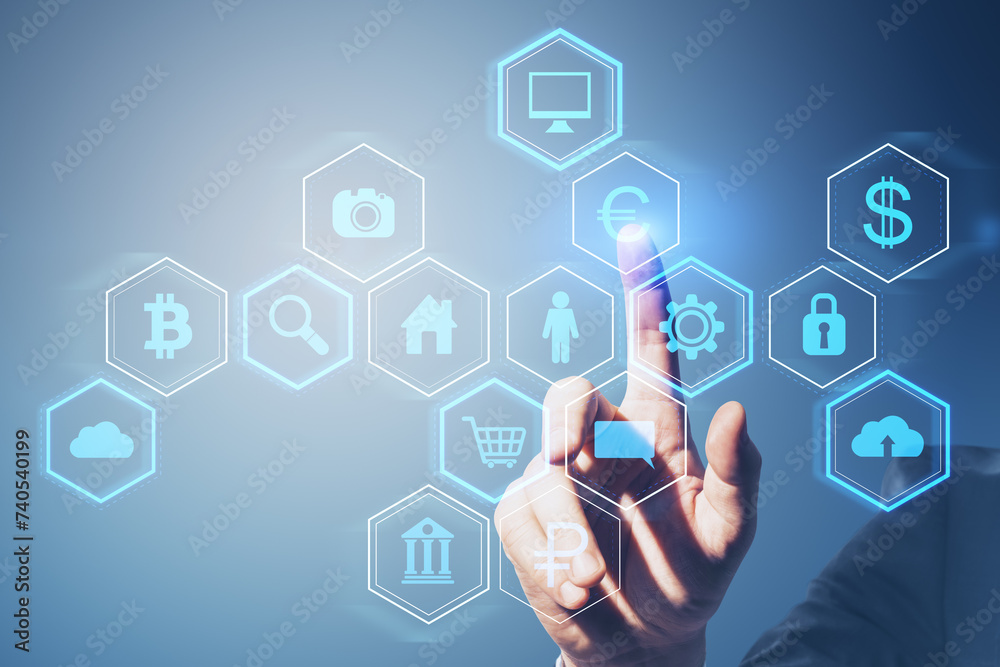 Poster Close up of businessman hand pointing at abstract hexagonal pattern hologram with various business icons on light blue background. Digital dashboard and data concept.
