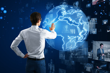 Businessman interacting with digital world map, global network theme. Dark blue background