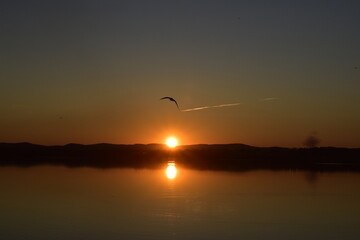 Orange sunset over the lake.