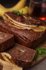 Fototapeta na wymiar Delicious banana bread on brown table, closeup