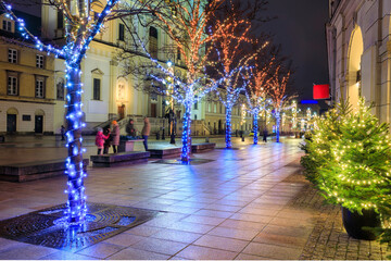 Beautiful architecture of the Royal Route with Christmas illuminations in Warsaw. Poland