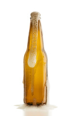 Bottle of blonde beer with foam out, isolated on white background